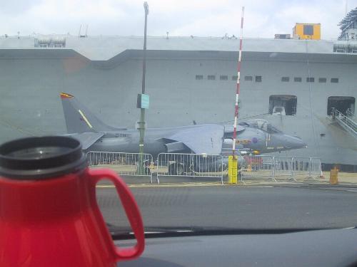 Sea Harrier in front of HMS Ark Royal